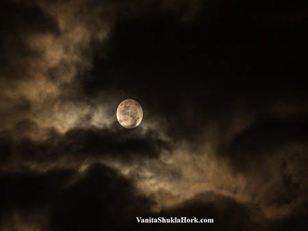 Scorpio Full Moon behind clouds